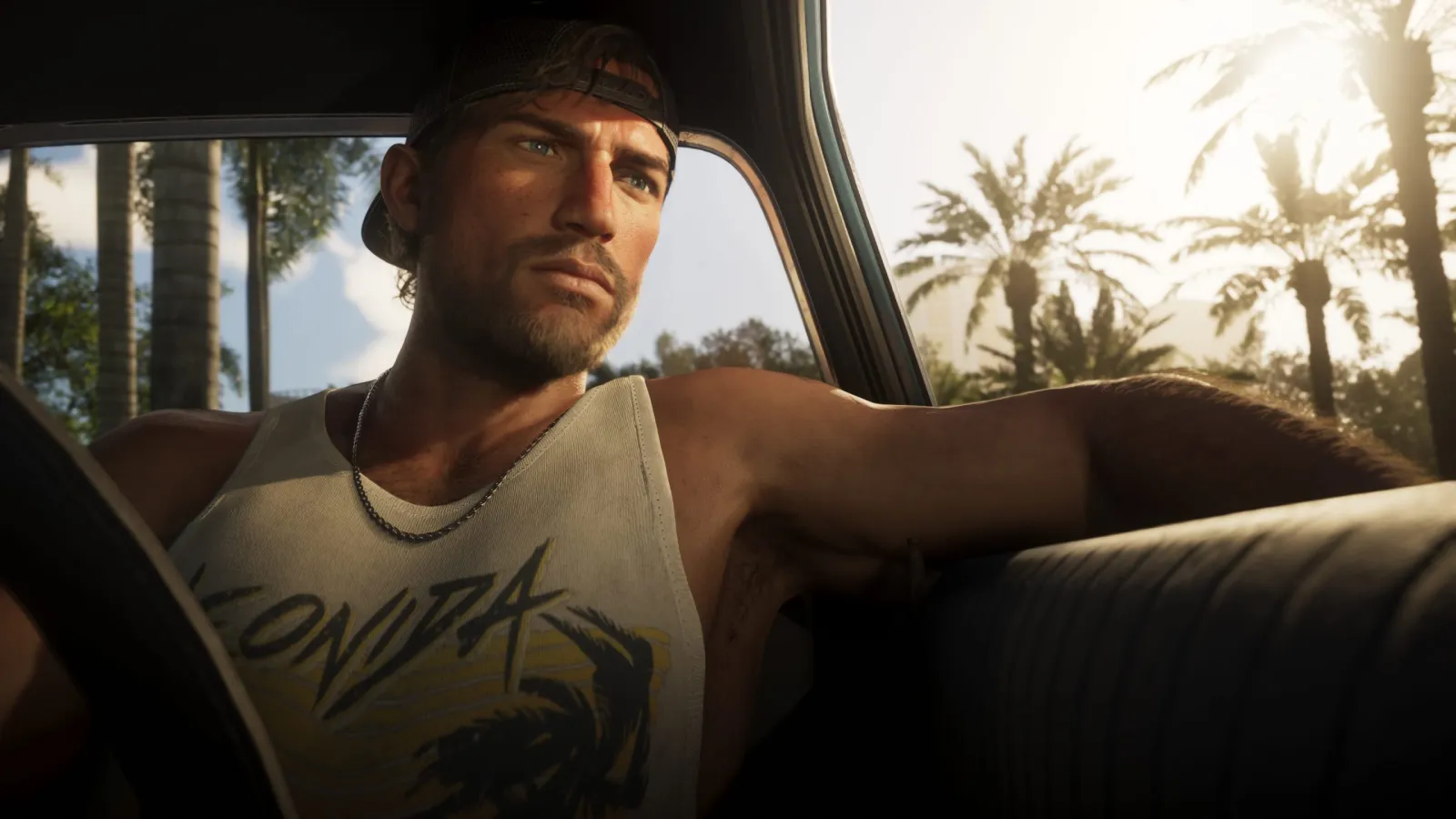 Jason from GTA 6 driving a convertible down a palm-lined Vice City road in daylight